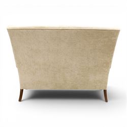 Parker Knoll - 'Hartley' lounge suite, comprising three wingback armchairs and two-seat settee, upholstered in cream fabric, shaped wing backs with scroll-over arms and loose seat cushions, on cabriole supports with pad feet wingbacks and settee

Armchairs: H 96cm, D 83cm, W 75cm