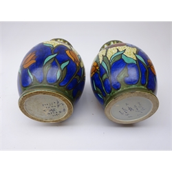  Pair Gouda floral decorated vases, ovoid form with pinched neck, marked 1900 Senga Gouda Holland, H24cm   