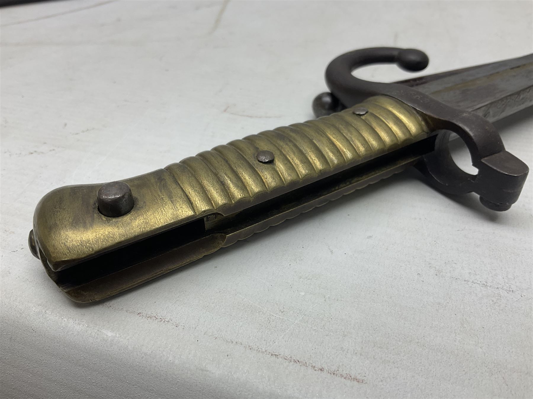 French Model 1866 Chassepot bayonet with 57cm curving fullered steel blade dated 1873 No.L63963; in steel scabbard with conforming number L71.5cm overall; and French St. Etienne Gras bayonet dated 1878 No.K10674 in steel scabbard numbered 79437 (2)