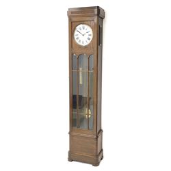 Early 20th century Art Deco oak longcase clock, circular dial with roman numerals and minute track, dial signed 'Barnby & Rust, Hull', twin chain driven movement striking the hours on gong rods. With weights and Pendulum.