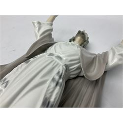 Lladro figure, The Loaves and Fishes, modelled as Jesus Christ with arms raised standing beside a basket of loaves and a basket of fish, sculpted by Salvador Furió, with original box, no 5896, year issued 1992, year retired 1997, H35cm