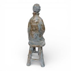Studio pottery figure, modelled as a boy seated upon a stool, H68cm 