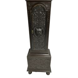 Victorian Jacobean revival oak cased 30 hour longcase clock - with a carved pediment and break arch door beneath, door with attached pilasters and gesso capitals, break arch trunk door with a carved grotesque, conforming carved plinth raised on ball feet, brass dial with spandrels, matted centre and chapter ring, dial pinned to a chain driven countwheel movement, striking the hours on a bell.
With weight and pendulum.