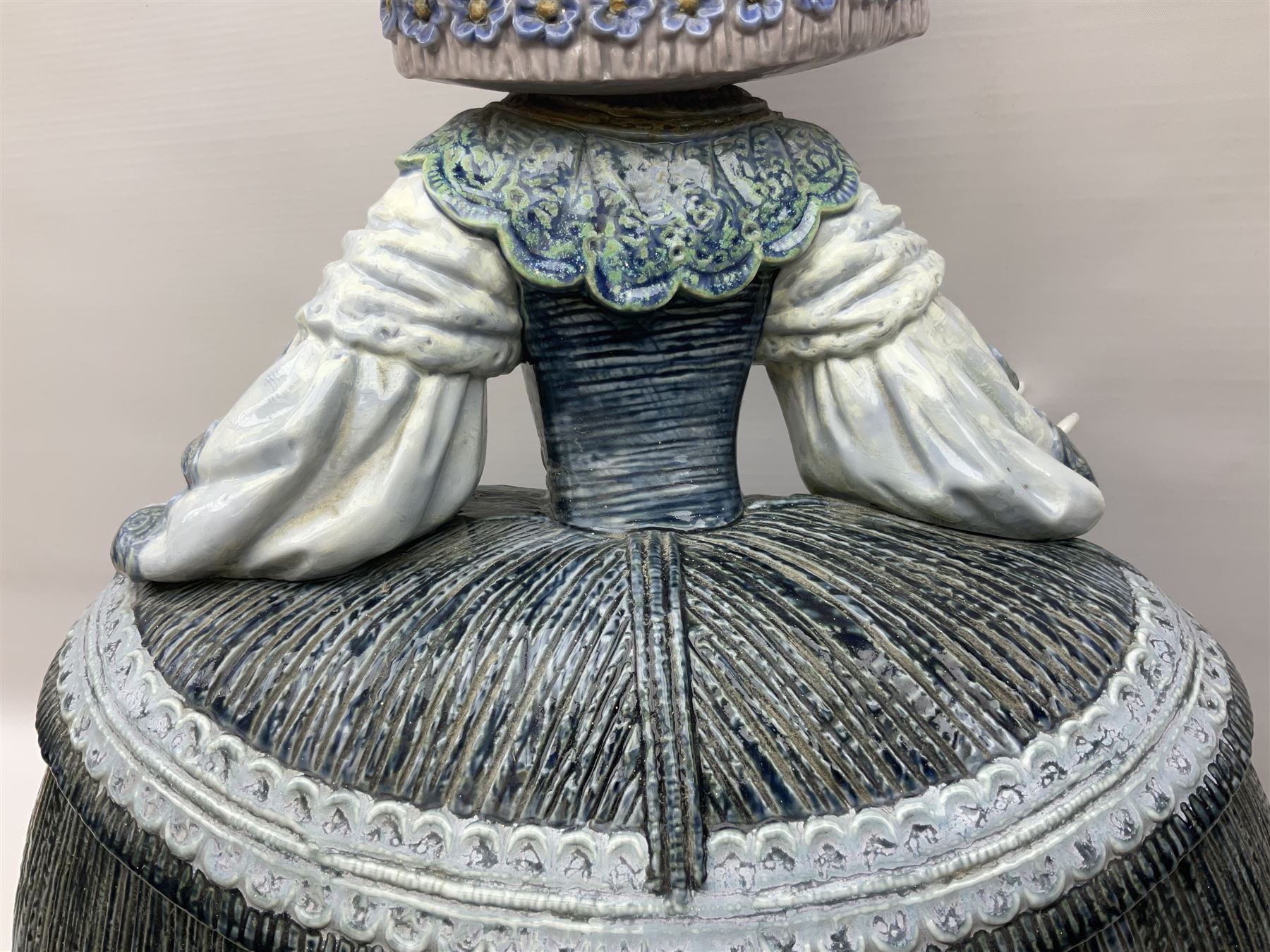 Large Lladro figure, La Menina, modelled as a maid of honor in service, on a mahogany oval base, limited edition 99/1000, sculpted by Jose Puche, with certificate of authenticity, framed and glazed, no 1812, year issued 1996, year retired 2019, H60cm