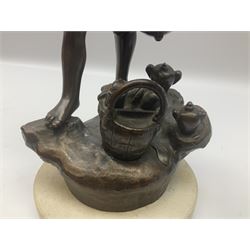 Spelter figure of a boy shouting on a stone base, H36cm. 
