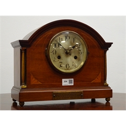  20th century inlaid mahogany arched top mantel clock with silvered Arabic dial, brass columns and feet, half hour strike twin train movement, with 1926 LNER Carriage Works presentation plaque, H27cm     