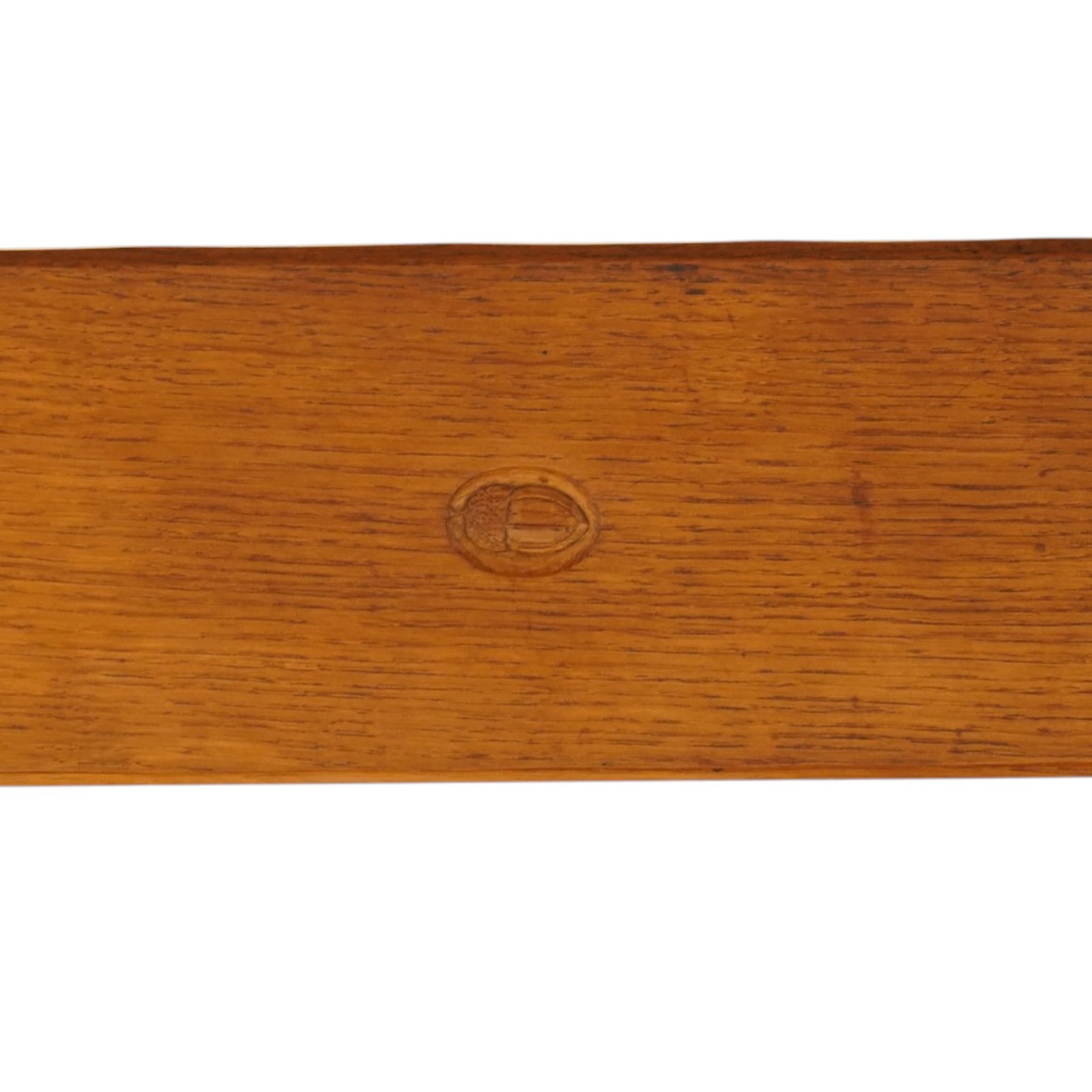 Acornman - adzed oak refectory dining table, rectangular adzed top with rounded corners raised on twin shaped end supports terminating to sledge feet united by pegged stretcher, carved with acorn signature