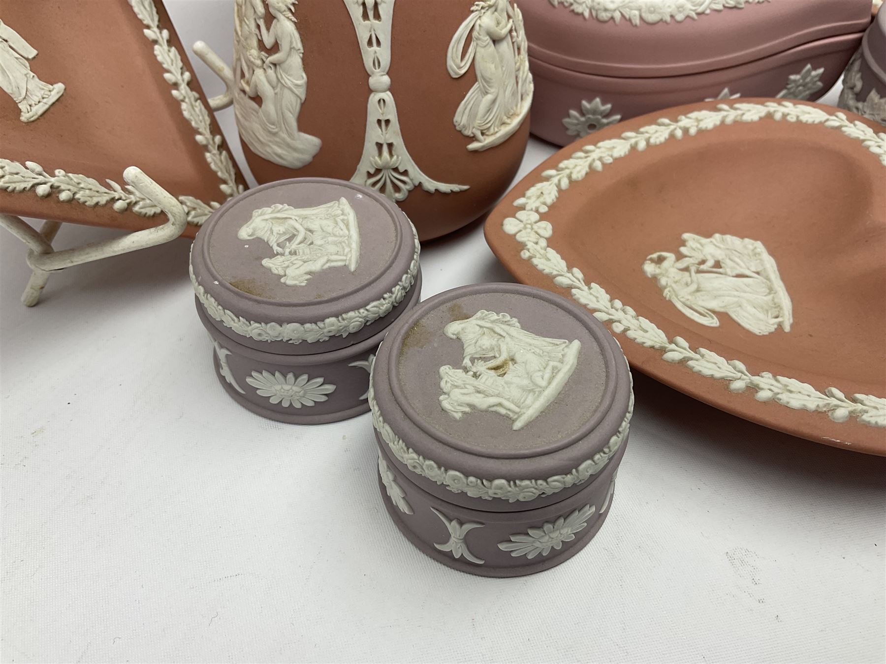 Collection of Wedgwood Jasperware, in orange, lilac and pink colourways, including oval tray, small jug, trinket boxes, trinket dishes, etc , all with impressed mark beneath