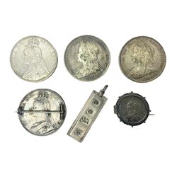 Three Queen Victoria silver crown coins dated 1887 and two 1895, 1889 crown with soldered pin, 1887 shilling loose mounted as a brooch and a hallmarked silver ingot pendant