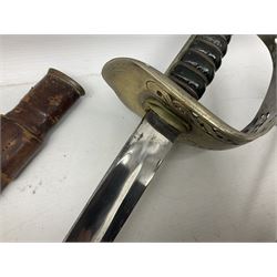 George V British Army 1897 pattern officers sword with plain 82cm fullered steel blade, pierced  basket hilt with George V cypher and wire bound leather grip with chequered backstrap; in leather covered field service scabbard L101cm overall; and another officer's sword in relic condition lacking scabbard (2)