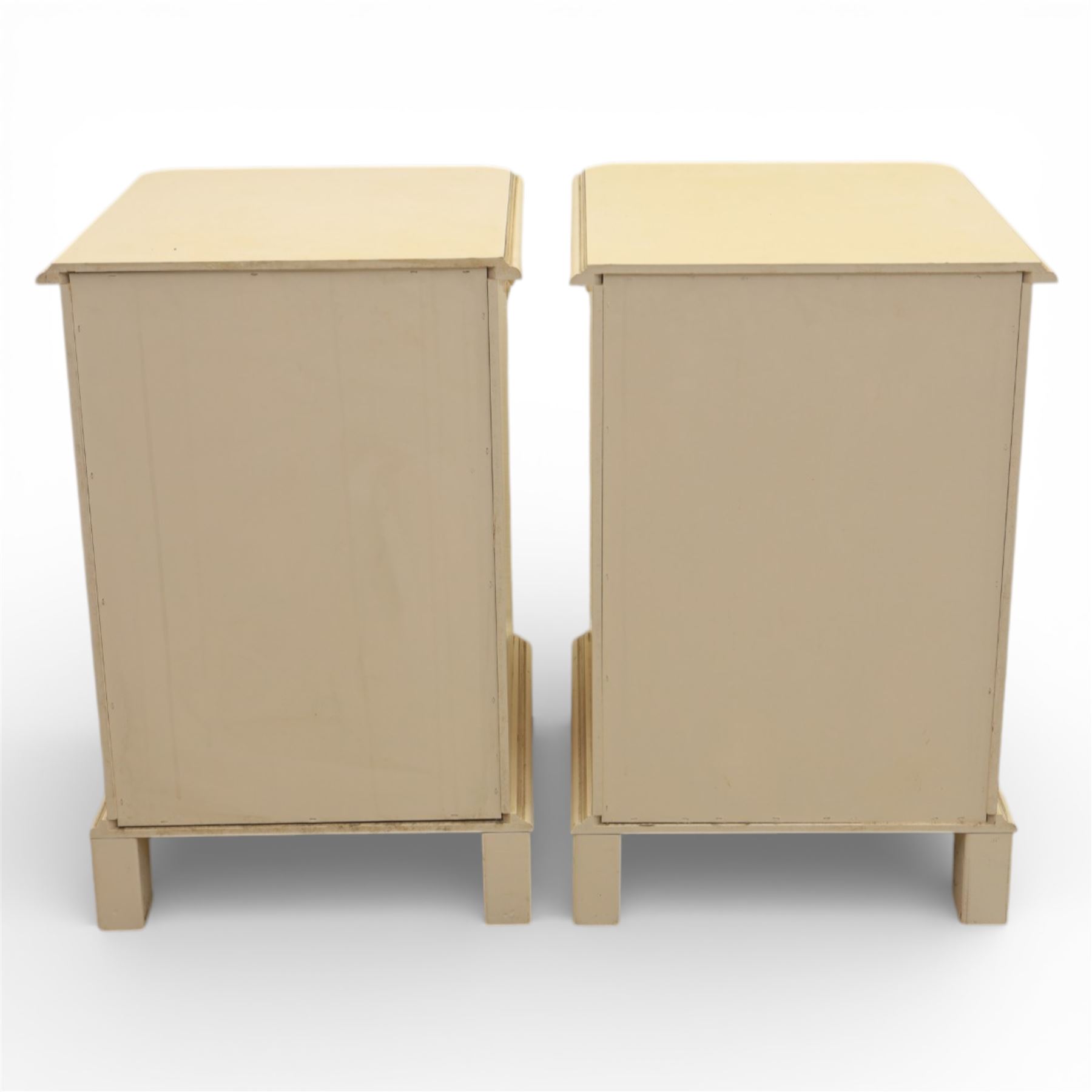 Contemporary French design white painted bedroom suite retailed by Barkers of Northallerton, comprising wide chest fitted with four short and four long drawers with oval brass handles (H 70cm, W 159cm, D 46cm), pair of bedside chests each fitted with three drawers (H 62cm, W 40cm, D 46cm), dressing table fitted with four short drawers and central kneehole with shaped apron (H 79cm, W 131cm, D 46cm) with matching framed wall mounted mirror (H 100cm, W 113cm), and full length standing mirror (H 175cm, W 73cm)