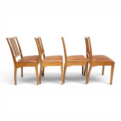 Acornman - set of four oak dining chairs, chamfered slatted back, tan leather drop in seat, raised on square supports with carved acorn signature, by the workshop of Alan Grainger of Brandsby
