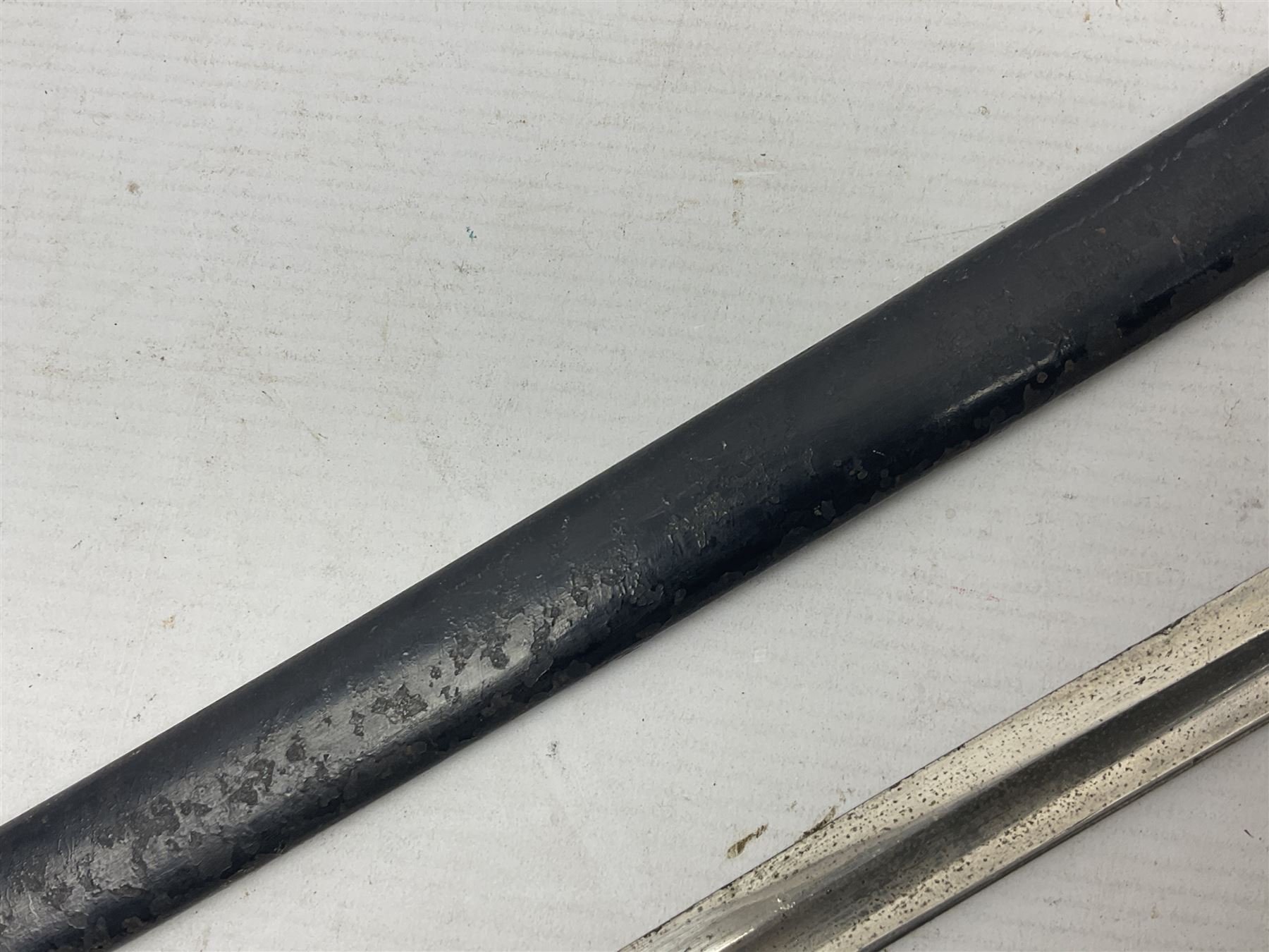 Prussian artillery officer's sword, with 80cm slightly curving fullered  blade, brass hilt with D-shaped langets, curving knucklebow, wire-bound black grip and leather finger loop; in black painted steel scabbard with single suspension loop