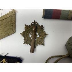 WWII group of three medals comprising 1939-45 War Medal and Italy and Africa Stars in issue box; dog tags for 282894 W. Wilkinson with framed photograph in uniform; and small quantity of cloth and metal badges including RAOC cap badge