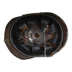 WWI Prussian M1915 Pickelhaube, the black leather skull with removable steel spike finial, steel eagle helmet plate and leather chin strap, one side with a black cockade, the other black and red