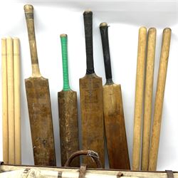 A Vintage leather cricket bag and equipment, to include cricket bats, balls, wickets, and pads. 