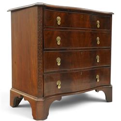 Quality Georgian design mahogany serpentine secretaire chest, the shaped top with moulded edge, fitted with cock-beaded secretaire drawer with button-release fall-front enclosing fitted interior, over three graduating drawers with brass drop handles on pierced circular plates, the canted uprights carved with blind-fret strapwork, lower moulded edge on shaped bracket feet