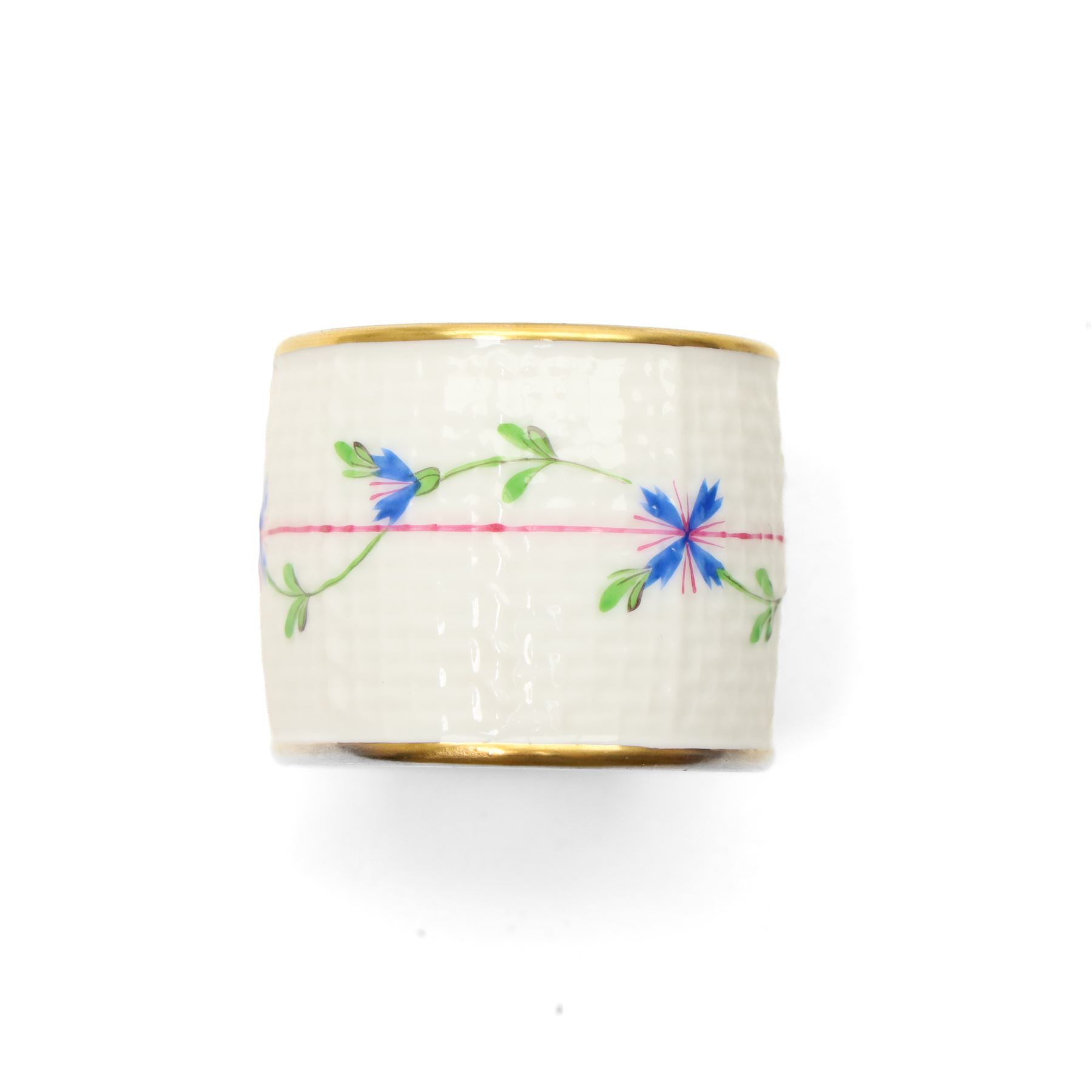 Set of twelve Herend porcelain napkin rings painted with trailing flowers and leaves on a moulded ground
