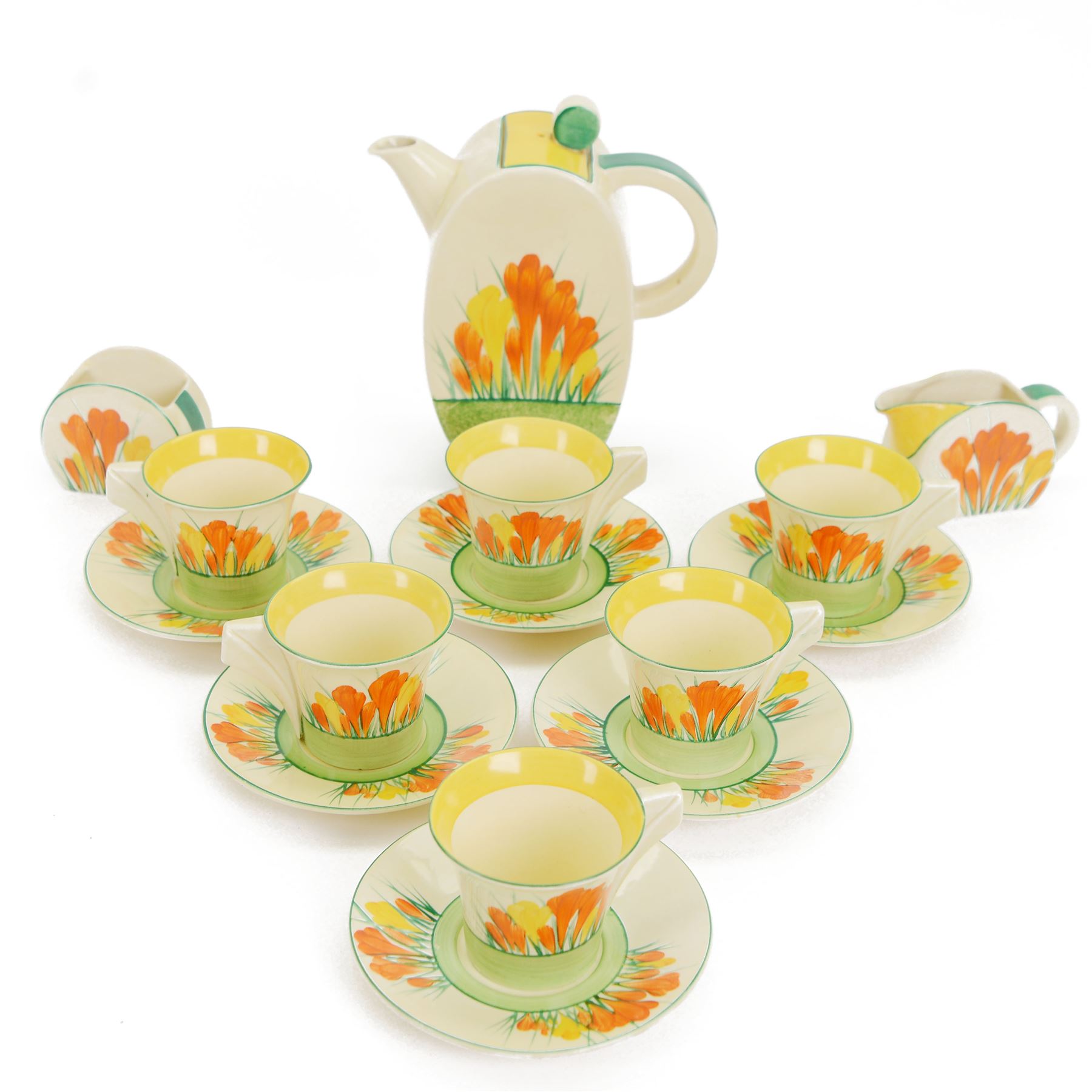 Clarice Cliff Biarritz Bonjour shape tea service for six, in Sungleam Crocus pattern, comprising teapot, milk jug, open sucrier, cups and saucers, all with printed Biarritz by Clarice Cliff  Wilkinson Ltd England beneath, teapot H20cm

