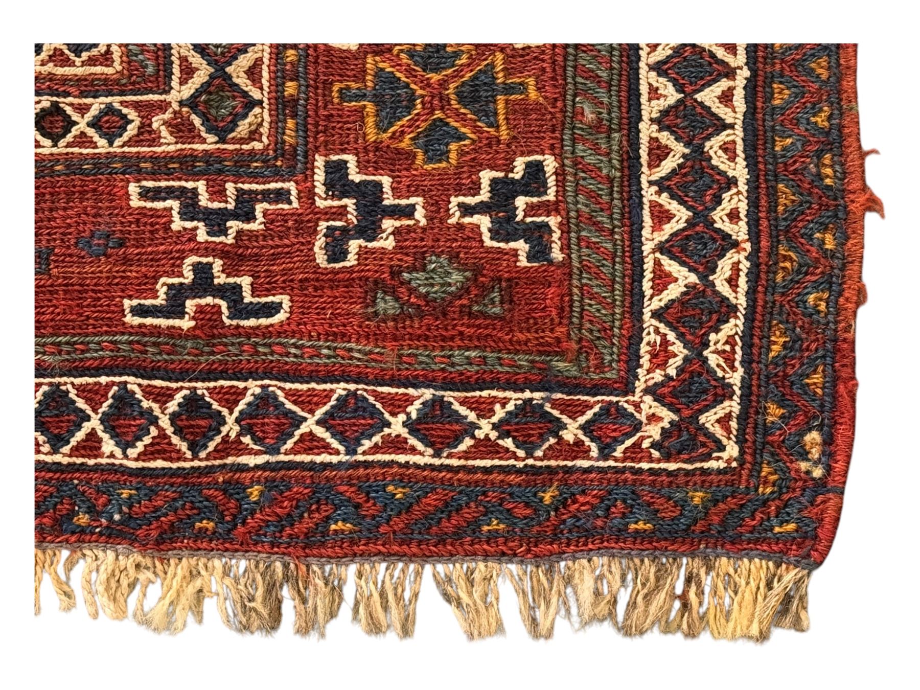 Persian-style wool rug, cream field with floral and geometric motifs, wide floral border (74cm x 142cm); Persian wool rug, beige field with dense floral patterns, narrow floral border (70cm x 144cm); Tribal wool rug, red and navy with diamond motifs (96cm x 60cm); Persian pictorial wool rug, black field with vase, birds, and floral border (70cm x 73cm)