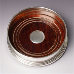 Pair of Elizabeth II silver bottle coasters with turned wooden bases D12cm, Birmingham 1994 Maker W I Broadway & Co.