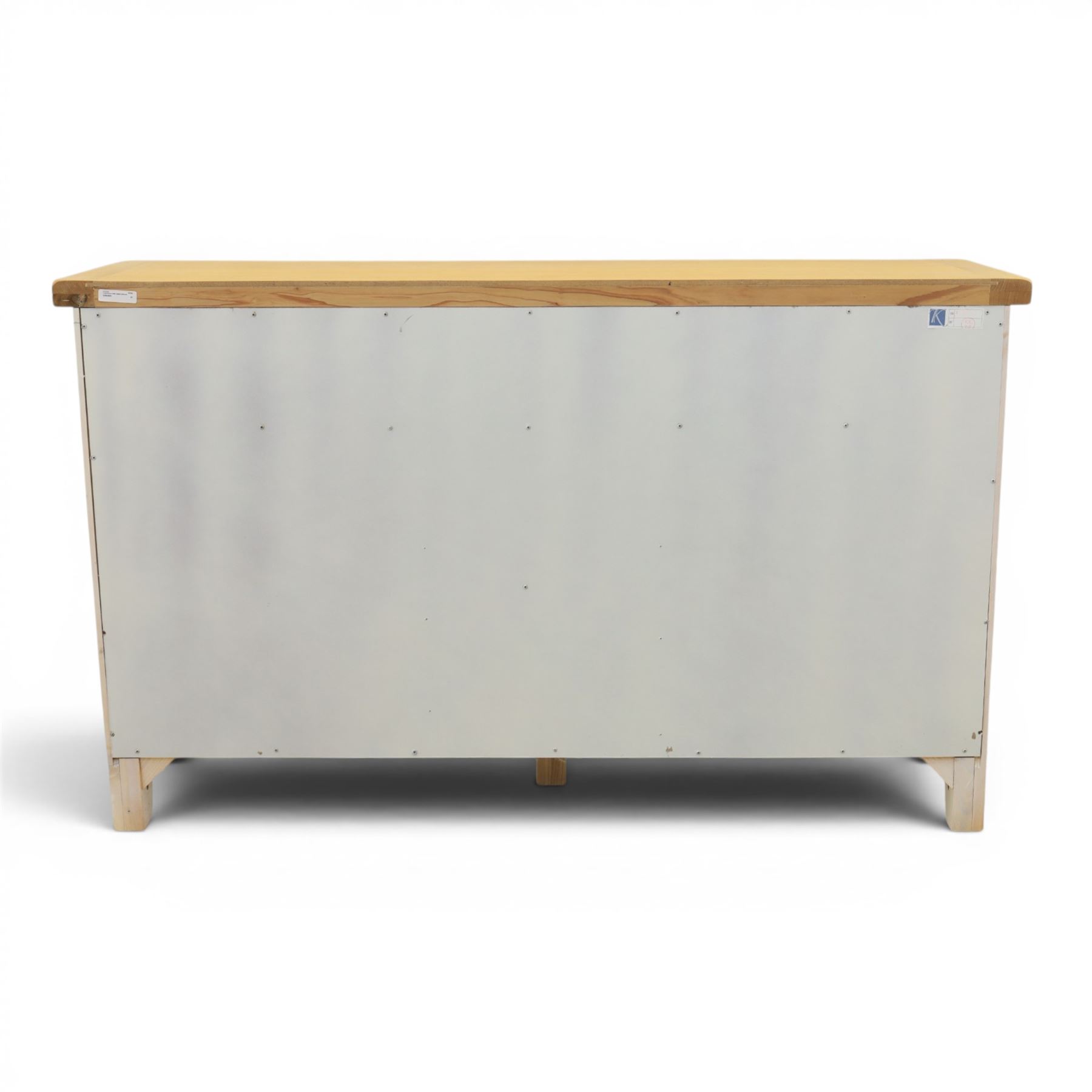 Contemporary white painted sideboard, oak veneered top above three drawers with metal cup handles, two central rattan drawers flanked by cupboards