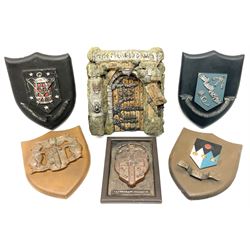 Terry Pratchett Discworld plaques, designed by Clarecraft, comprising 'the First Discworld Event Clarecraft August 95', the collectors guild joining shield, the fools guild DW99C, the seamstresses guild DW98C, the musicians guild DW00C together with 'Door of the mended drum' wall hanging DW17. 
