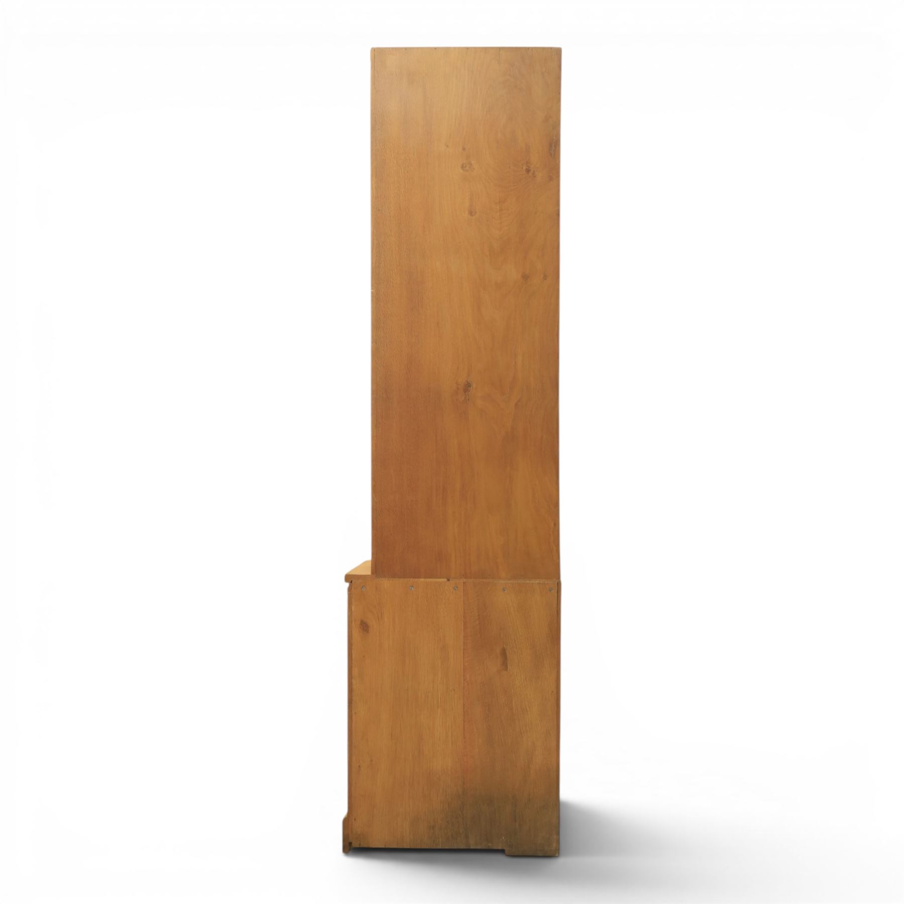 Mouseman - oak floor standing corner cabinet, scalloped cornice above a leaded glass cabinet, blackened metal hinges and latches, with carved mouse by the workshop of Robert Thompson of Kilburn