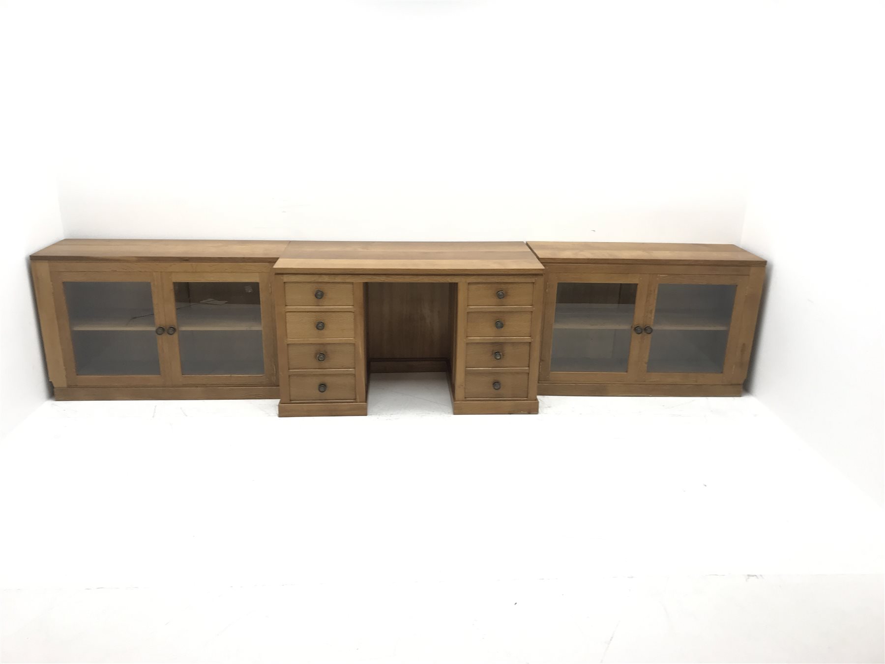 'Lizardman' oak kneehole desk fitted with six drawers and two glazed bookcases, by Derek Slater of Crayke, W347cm, H72cm, D61cm