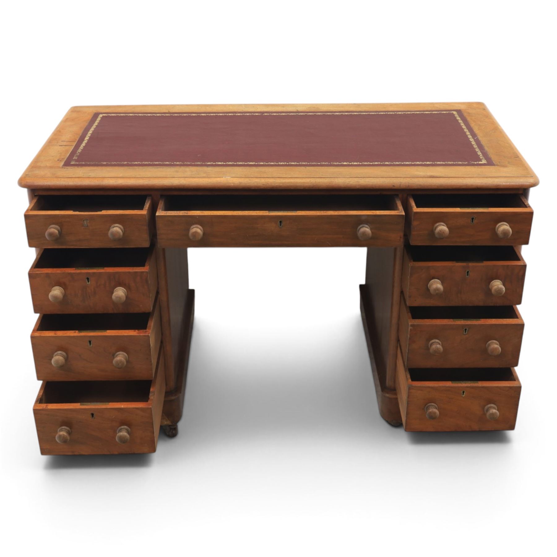 Victorian mahogany twin pedestal desk, rectangular top with red tooled leather writing surface with three frieze drawers, each pedestal with three drawers and castors