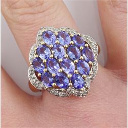 9ct gold marquise shaped tanzanite and diamond chip cluster ring, stamped 375 