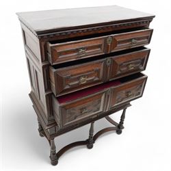 17th century oak chest on stand, moulded cornice over block work frieze, the upper section fitted with three long drawers each decorated with applied geometric mouldings and faceted panels, panelled sides with moulded frame, the stand fitted with two drawers, on five turned supports united by plan flat stretchers, terminating to turned feet
