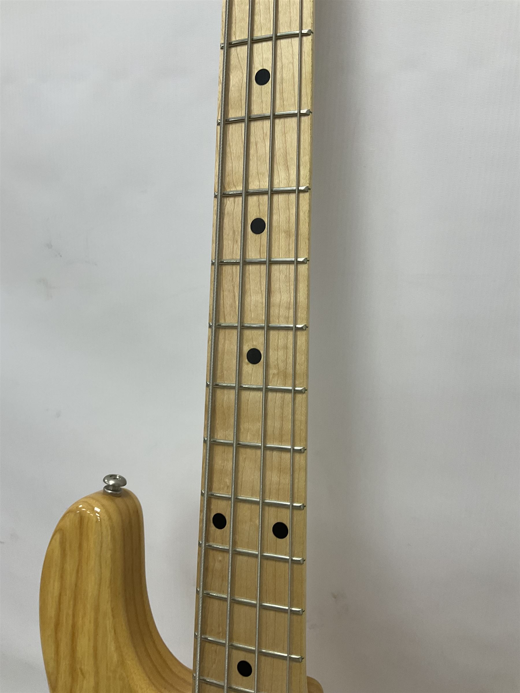 Ernie Ball Music Man Sting Ray 4 string bass guitar, in natural finish with roasted maple neck and tortoiseshell effect scratch guard, serial no 87485, in black Music Man hard case, guitar L114cm