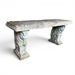 Weathered cast stone three piece garden bench, slab top raised on mythical creature supports