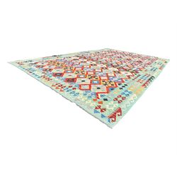 Kilim pastel ground rug, the field decorated with repeating multicoloured geometric diamond motifs, enclosed within matching geometric borders