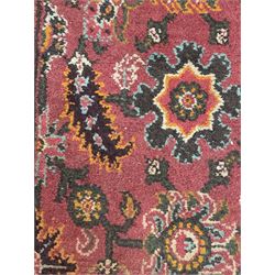 Belgian Sultan woollen ground rug, central navy field densely decorated with floral sprays and geometric patterns (192cm x 135cm); handwoven tribal terracotta ground rug (121cm x 71cm); Persian crimson ground runner, all over stylised floral and foliate motifs (266cm x 94cm)