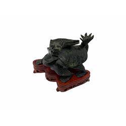 Group of Oriental hardstone and soapstone figures, comprising pair of seated temple lions upon plinth bases, model of a water ox with boy seated upon its back, dragon turtle, and figure group carved as two dogs of foo or lions. 
