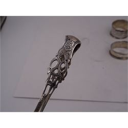 Pair of Victorian silver sugar tongs, with pierced decoration, hallmarked Hilliard & Thomason, Birmingham 1892, together with three hallmarked silver napkin rings