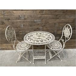 Cast metal bistro set including ornate oval garden table and two matching chairs