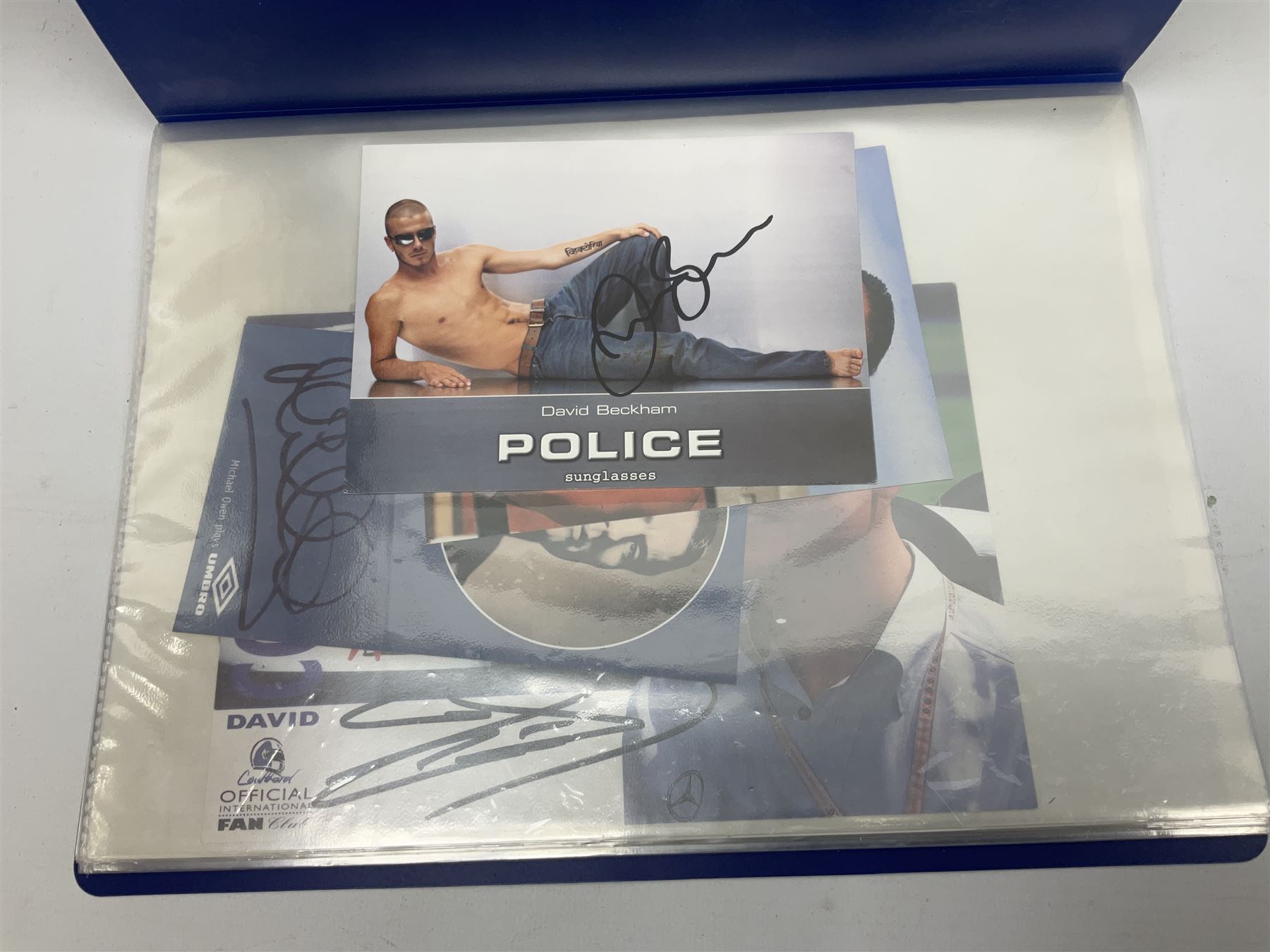 Two folders of over fifty photographs, cards, compliment slips etc of actors, actresses, celebrities, politicians, sports personalities etc, all bearing signatures, including David Frost, Lloyd Grosman, John Suchet, Julia Somerville and othe GMTV presenters, Carol Vorderman, Jackie Collins, Rolf Harris, Timothy Dalton, Pete Postlethwaite, Magnus magnusson, John Major, Kate Moss, Uri Geller, David Beckham, Peter Alliss, Sharon Davies, Kevin Keegan etc