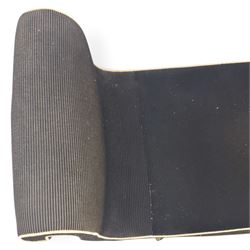 Victorian ebonised chaise longue, upholstered in black fabric with scroll headrest and bolster cushion, rectangular seat with rounded corners, raised on turned supports terminating in brass and ceramic castors