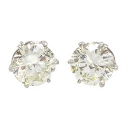 Pair of platinum round brilliant cut diamond stud earrings, Birmingham 1981, total diamond weight 5.00 carat, VS1-VS2 clarity, colour K, with World Gemological Institute certificate