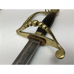 Five-ball spadroon sword with 78.5cm fullered steel blade and brass hilt with fluted swollen grip; in brass mounted leather scabbard, the locket with traces of the makers name John Knubley 11 Charing Cross L97.5cm overall