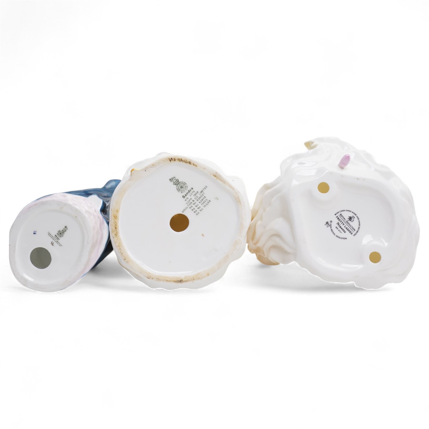 Eleven Royal Doulton figures, including Miss Demure HN1402, Ninette HN4717, Janet HN1537, Embrace HN4258 etc 