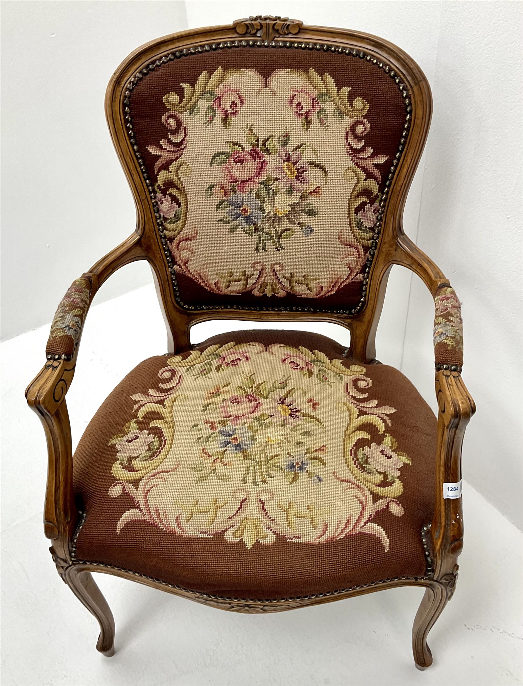 French walnut framed chair, scrolling arms, upholstered floral fabric, cabriole legs 