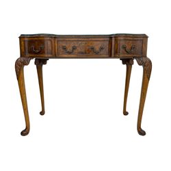 Early 20th century Queen Anne design walnut reverse break-front console side table, edge carved with acanthus decoration, fitted with three cock-beaded drawers, raised on cabriole supports with applied carved scrolling foliate decoration