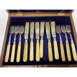 Canteen of silver plated cutlery, housed in a oak case with hinged lid and two drawers, together with a canteen containing twelve fish knives and forks 