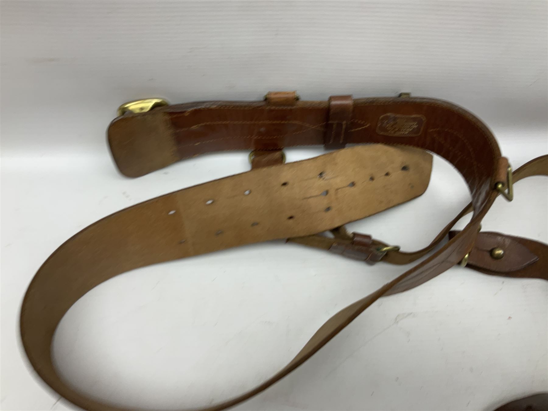 British Army General Staff officer's peaked cap by Herbert Johnson London in Moss Bros. delivery box; two officer's Sam Browne leather belts; leather pistol holster and sword hanger; pair of leather gloves and pair of spurs