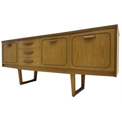 Stonehill - mid-20th century teak 'Stateroom' sideboard, fitted three drawers flanked by fall-front and double cupboard