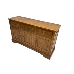 Willis & Gambier - oak sideboard, three drawers over three panelled cupboards, on bracket feet 